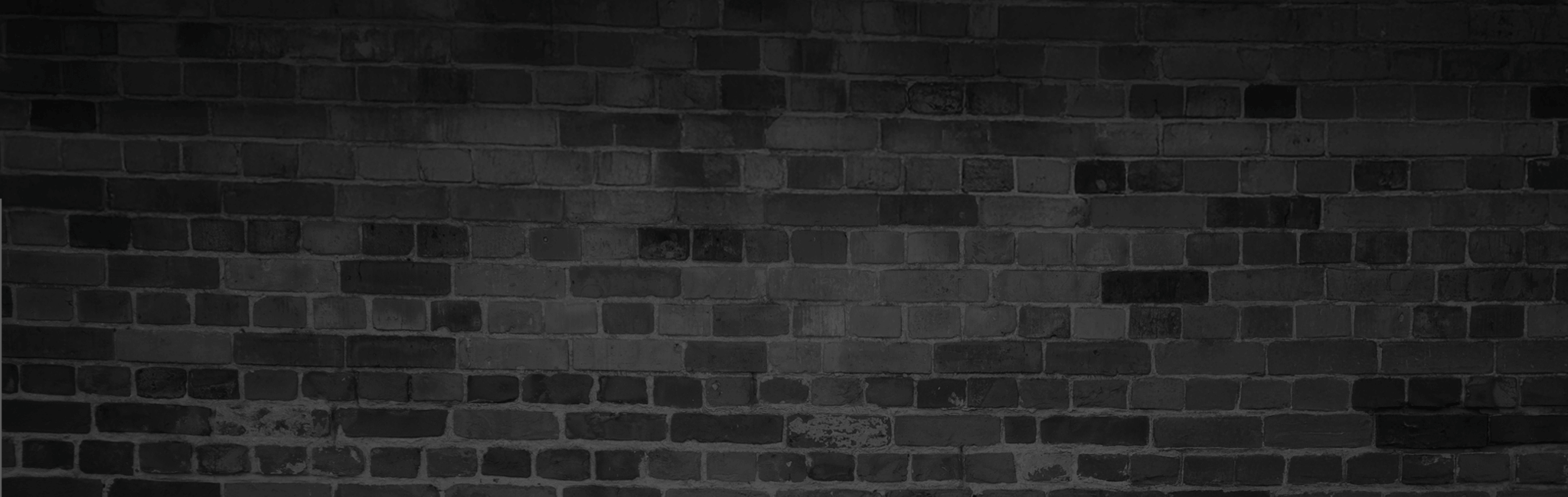 Black and white textured brick wall with an urban industrial look