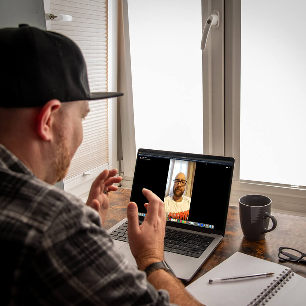 Designer on a video call discussing a project and providing design consultancy services